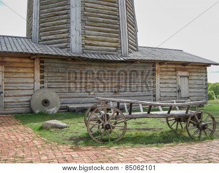 Wooden waggon near windmill
