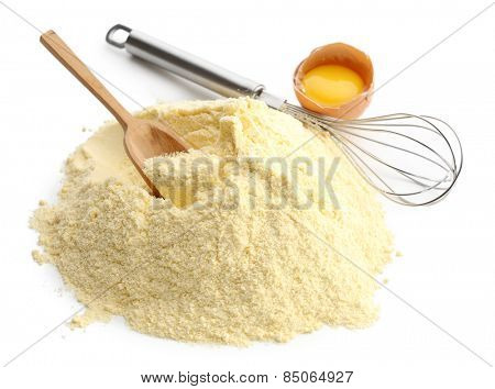 Heap of cornmeal with egg and corolla isolated on white