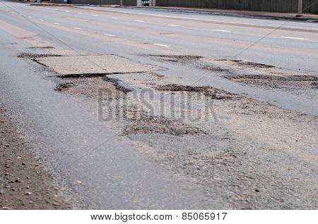 Big Hole In Street Asphalt