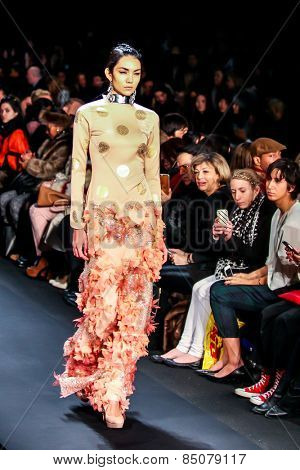 NEW YORK - FEBRUARY 13: A model walks the runway at the Mongol Fall/Winter 2015 collection during Mercedes-Benz Fashion Week in New York on February 13, 2015.