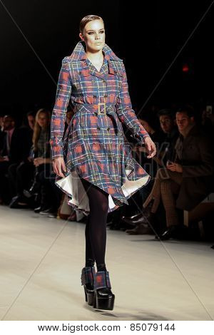 NEW YORK - FEBRUARY 13: A model walks the runway at the Mark & Estel Fall/Winter 2015 collection during Mercedes-Benz Fashion Week in New York on February 13, 2015.