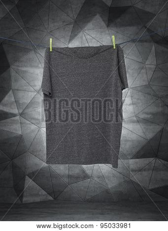 Close Up Of A Grey T-shirts On The Rope. Contemporary Background.