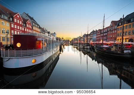 Ships in Nyhavn at sunset, Copenhagen, Denmark