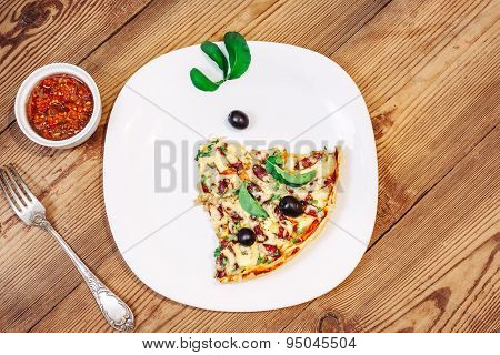 Slise of Pizza homemade with sauce on wooden background