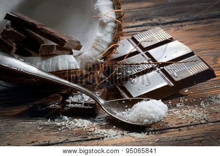 Chocolate and coconut on old table