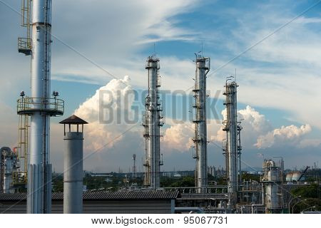 Process Columns of Natural Gas Plant with blue sky and cloud background