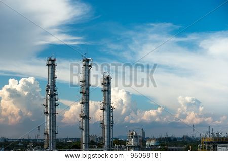 Process Columns of Natural Gas Plant with blue sky and cloud background