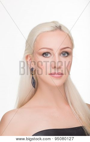 beautiful girl with long white hair and earrings. fashionable photo. portrait