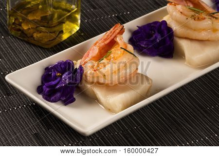 Grilled Shrimp With Raw Nail Fish On White Plate At Table