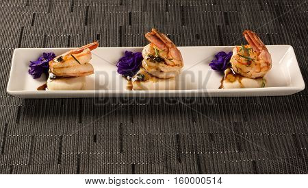 Grilled Shrimp With Raw Nail Fish On White Plate At Table