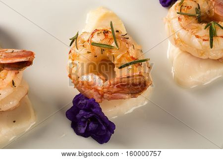 Grilled Shrimp With Raw Nail Fish On White Plate At Table