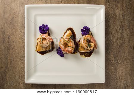 Grilled Shrimp With Raw Nail Fish On White Plate At Table