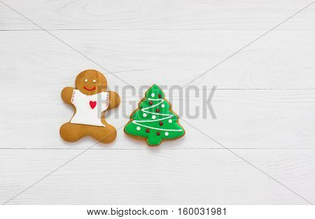 Happy New Year and Merry Christmas beautiful gingerbread on a wooden background in a gift