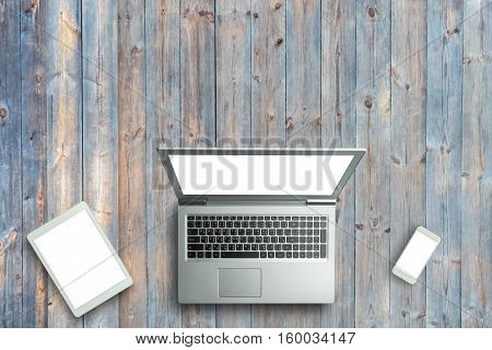 Top View Of Digital Laptop Computor, Tablet And Smartphone White Screen On Wooden Table Background.c