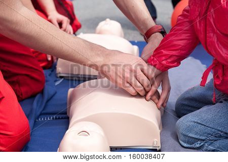 First aid training. Cardiopulmonary resuscitation - CPR. Chest compression.