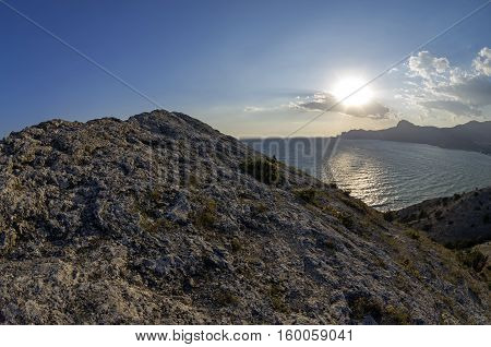 Late afternoon sun over the horizon. The top Alchak cape Crimea September.