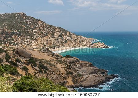 Massive boulders and white sand beaches next to the sea