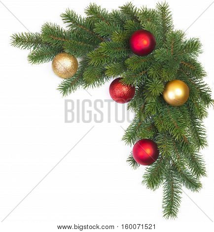 Corner Christmas fir branch with Christmas balls on a white background