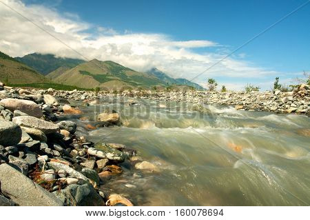A small river flows into Lake Baikal, Russia