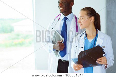 Doctors analyzing an x-ray in a meting