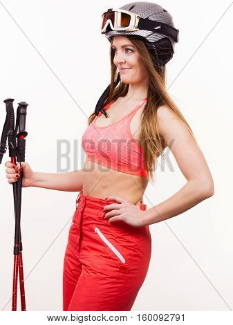 Woman Wearing Ski Suit And Helmet Holding Poles