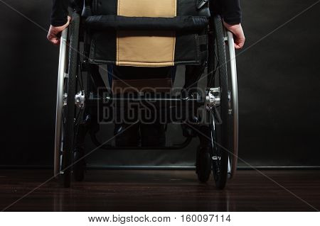 Disabled Person Sitting On Wheelchair.
