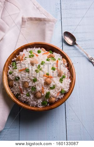 Yummy soya pulao or pilav or pulav or rice or soyabean chunk fried rice with peas and beans, indian or pakistani cuisine
