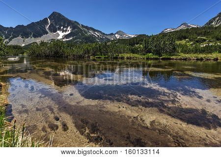 Landscape with Reflection of Sivrya peak in Banski lakes, Pirin Mountain, Bulgaria