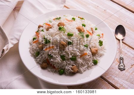 Yummy soya pulao or pilav or pulav or rice or soyabean chunk fried rice with peas and beans, indian or pakistani cuisine