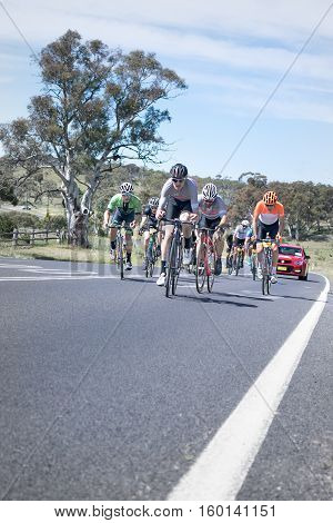 Jindabyne, Snowy Mountains Region, Australia - December 3, 2016: The first L'Etape cycling event held in Australia (by Le Tour de France).  The third breakaway group, all wanting to start the last stage in prime position.
