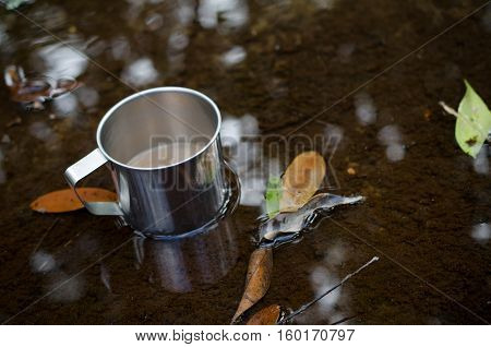 Place in a glass of hot coffee and cold clear streams. White sandals relaxing waterfront.