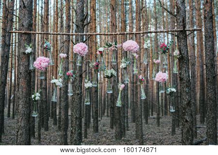 Wedding flowers decoration arch in the forest. The idea of a wedding flower decoration. wedding concept in nature.