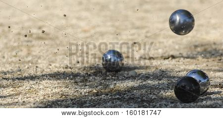 Metallic Petanque Three Balls And A Small Wood Jack