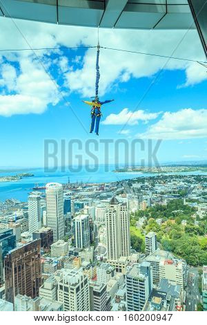 Auckland New Zealand- December 12 2013. A man bungee jumping from Auckland sky tower.
