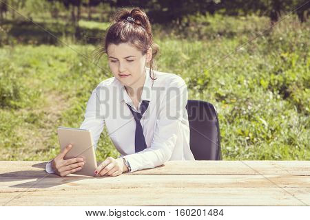 Vintage Image Of A Business Woman Who Uses A Mobile Device