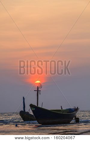 fisher boat and sun set sky at kon aow had mae rumpung rayong eastern of thailand