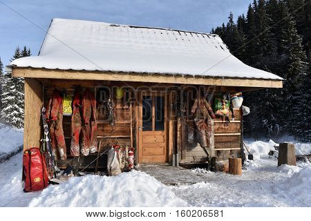 Cave Exploration Equipment Hanged On A Wooden Cabin