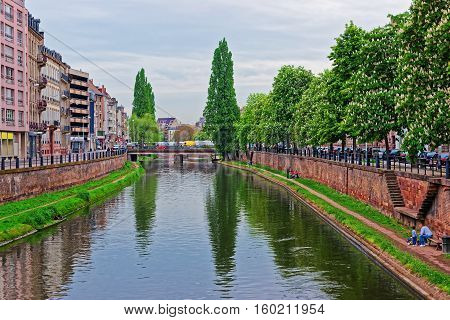 Strasbourg, France - May 5, 2012: Bridge over Canal du Faux-Rempart in the Grande Ile historic center of Strasbourg in France. People on the background