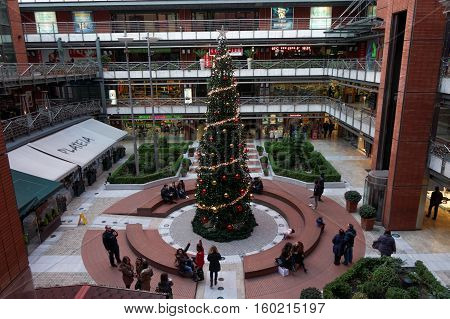 Thessaloniki, Greece - December 03 2016. Plateia mall Christmas tree.
People at the decorated Christmas tree at Plateia shopping mall in the center of Thessaloniki.