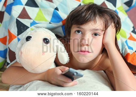 Boy In Bed Watch Tv With Remote Control