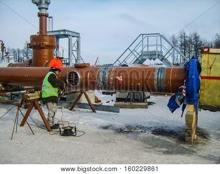 Safety at work. Welding and installation of the pipeline. Industrial weekdays welders and fitters.