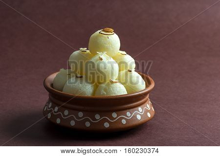 Indian Sweet - Rasgulla, Famous Bengali sweet in clay bowl