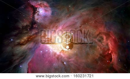 Spacecraft Progress orbiting the space nebula. Elements of this image furnished by NASA.