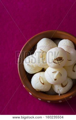 Indian Sweet or Dessert - Rasgulla, Famous Bengali sweet in clay bowl