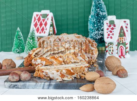 Homemade braided nutcake with quaint christmas decorations