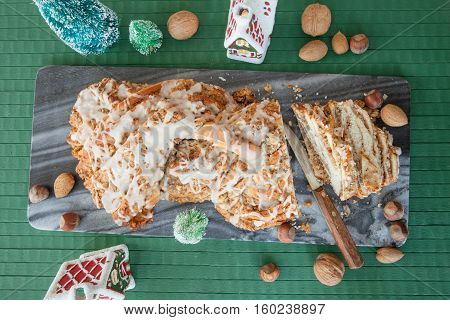 Homemade braided nutcake with quaint christmas decorations