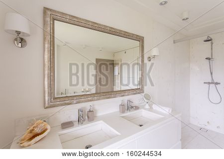 Minimalist Bathroom With Large Mirror