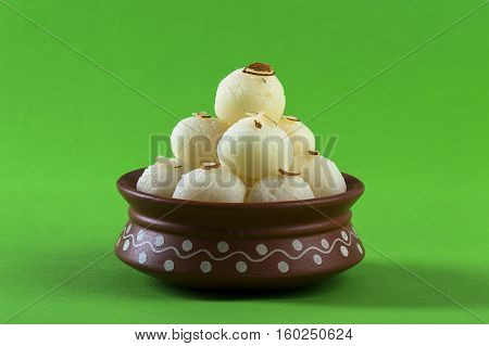 Indian Sweet or Dessert - Rasgulla, Famous Bengali sweet in clay bowl