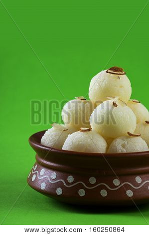 Indian Sweet or Dessert - Rasgulla, Famous Bengali sweet in clay bowl