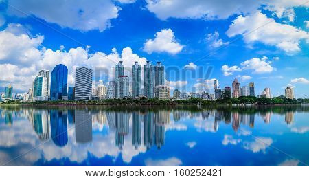 Cityscape image of Benchakitti Park at blue sky background in Bangkok Thailand.
